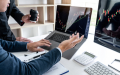 Business team partner working with computer, laptop, discussion and analyzing graph stock market trading.